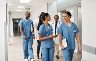 Doctors and nurses walking together in the hospital.