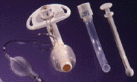 Cuffed tracheotomy tubes photographed against a black backgr