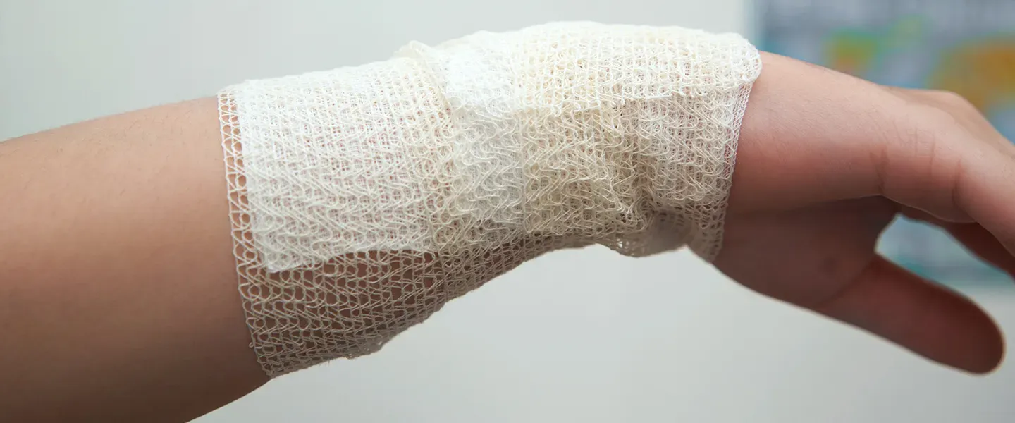 Burn Center_burn victim's hand wrapped in gauze.