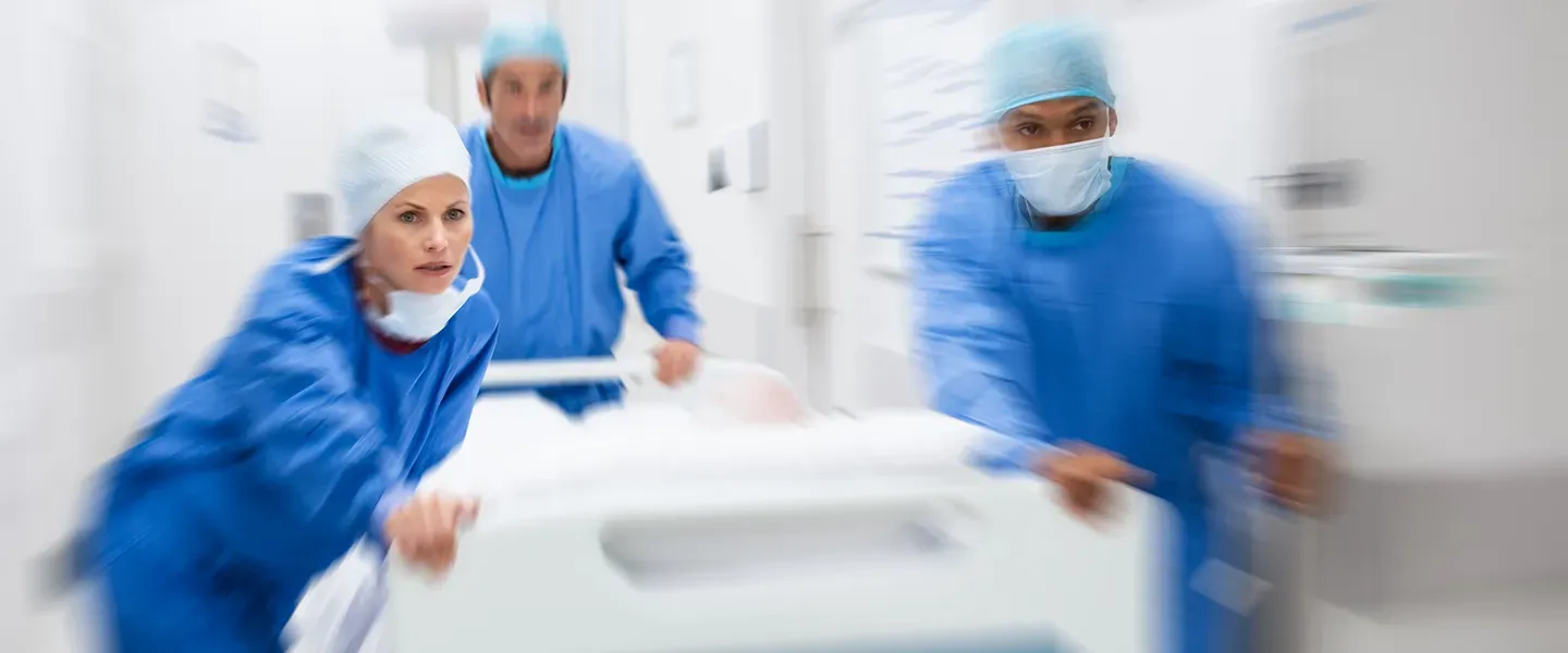 Doctors rushing a patient to surgery