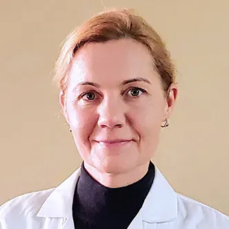 Anna Przybylska has blonde hair which is pulled back from he